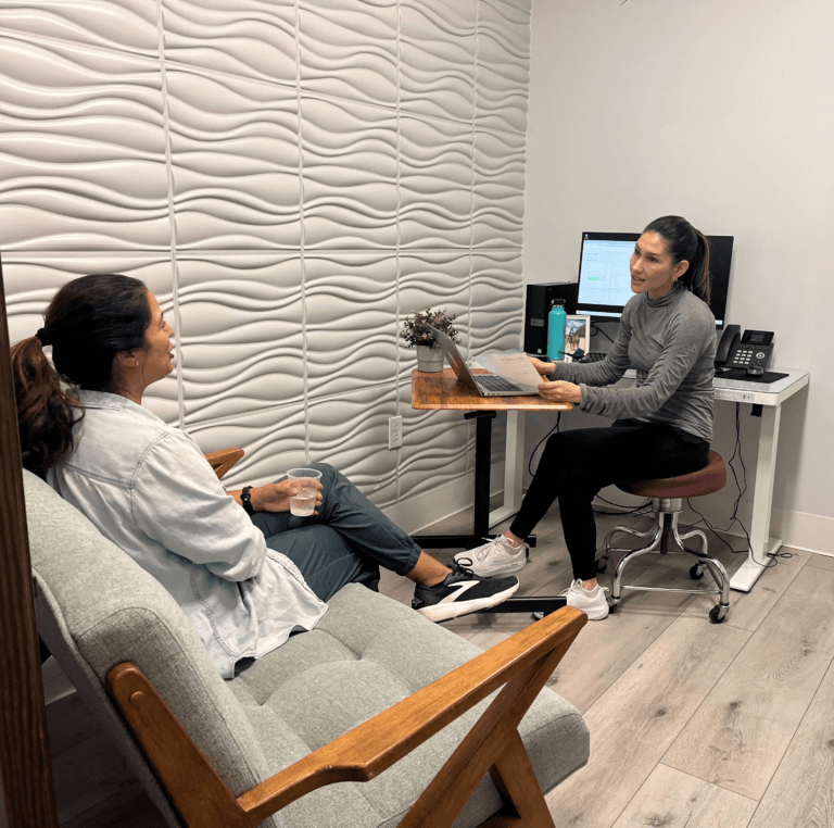 Health coach Carla Baccio meeting one-on-one with a patient